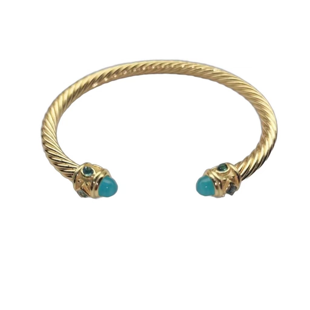022feba96623417e13bc93294807c800.jpeg Renaissance® Classic Cable Bracelet Sterling gold with 14K Yellow Gold, Blue Topaz and Lapis, 5mm - Image 1