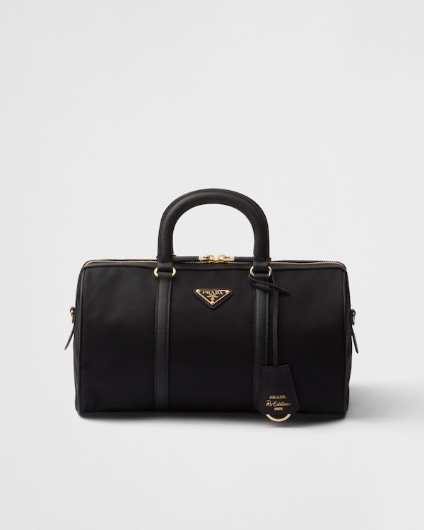 9f72224a1585e42ddeb95b5b3a91577c.jpeg Re-Edition 1978 medium Re-Nylon and Saffiano leather top-handle bag - Image 1